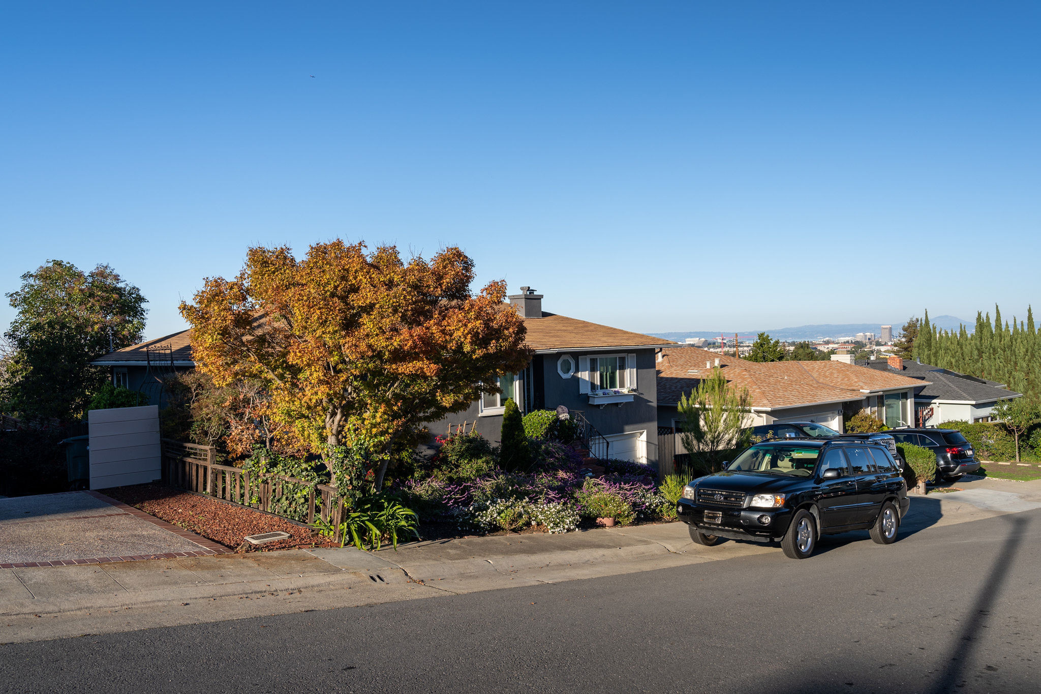 Gray craftsman home with black truck in  Westwood Knolls area in San Mateo