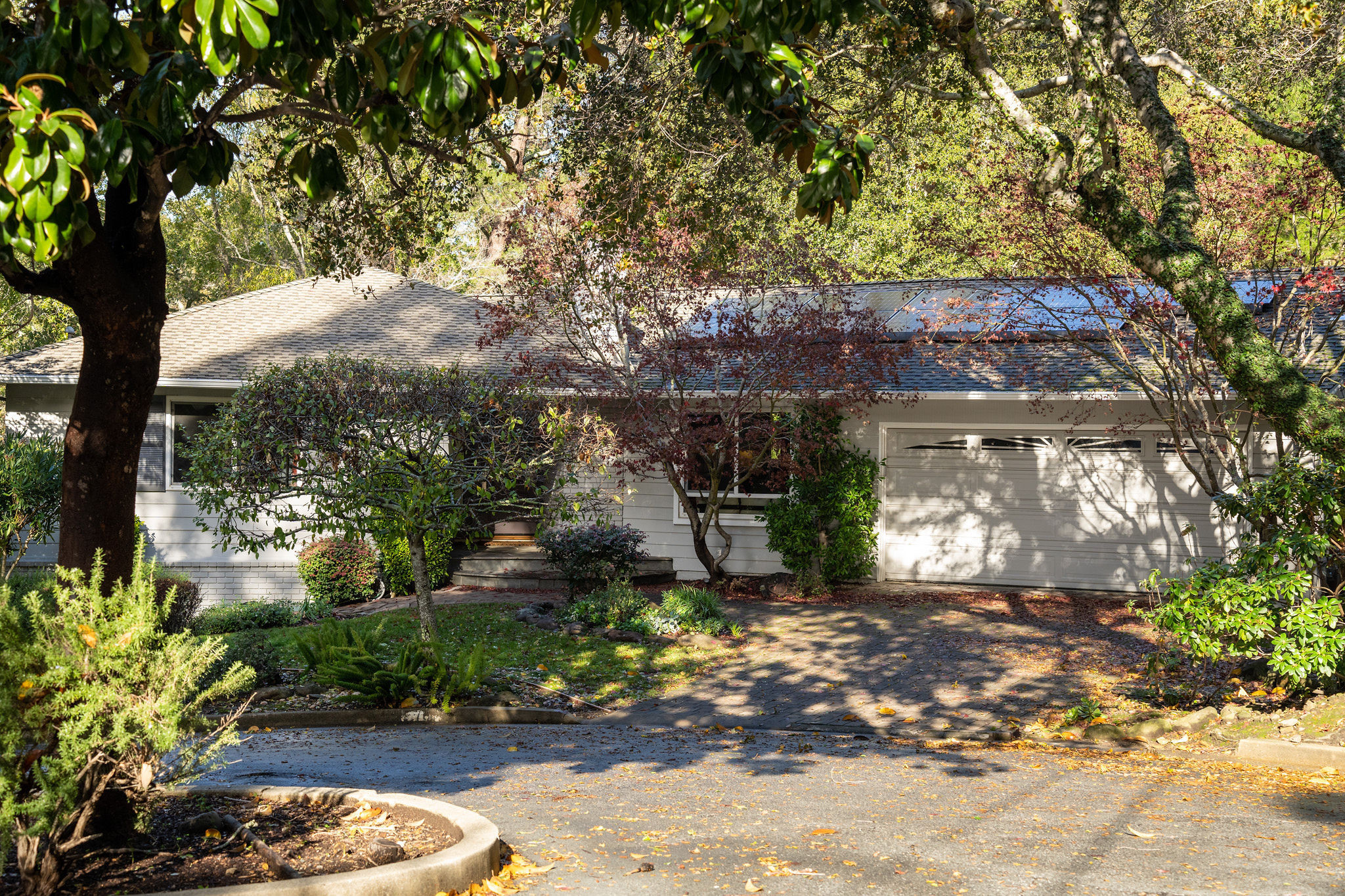 Baywood Knolls ranch style home with semi circle garage window in San Mateo.