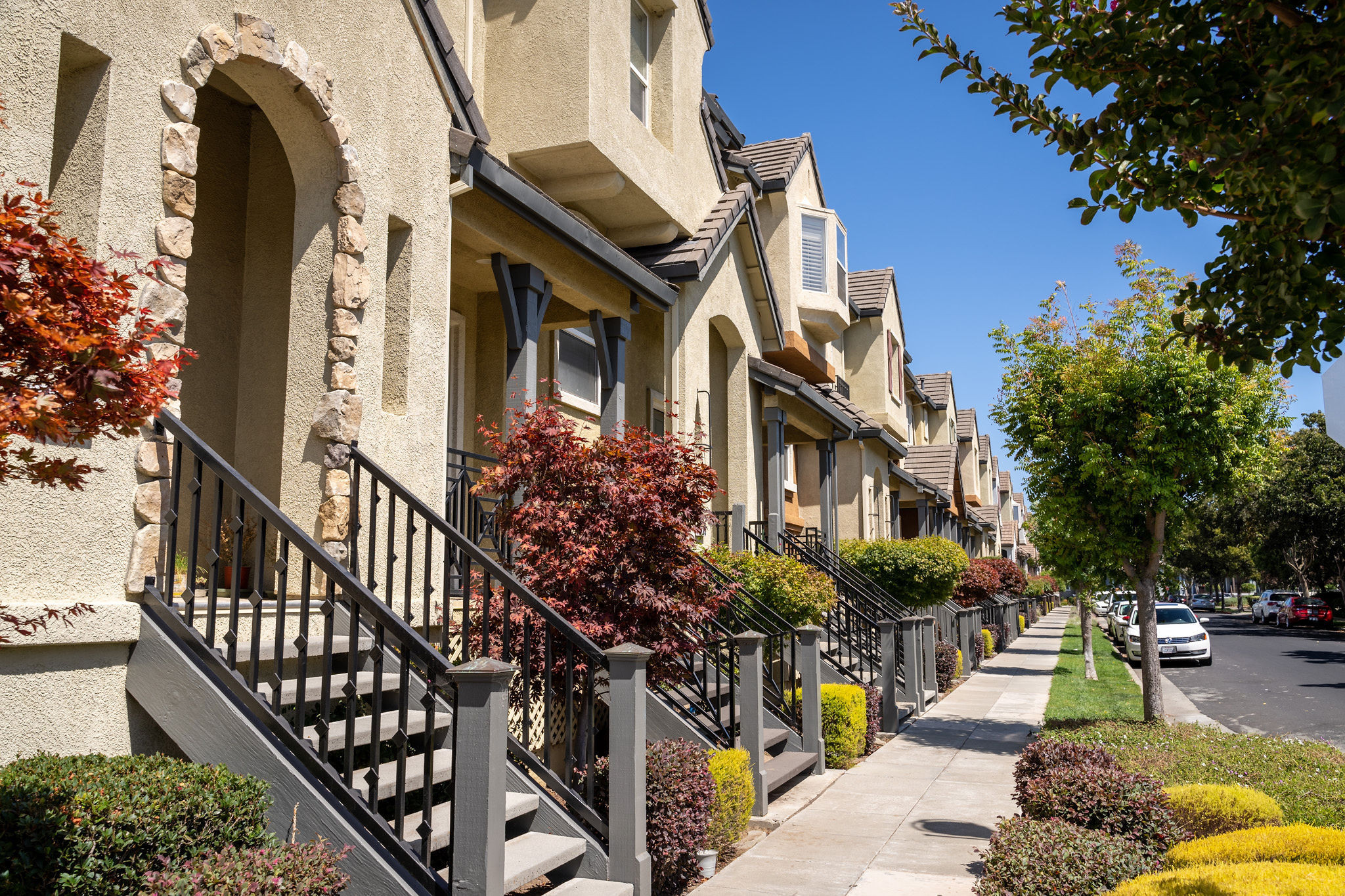 Bay Meadows/Fiesta Gardens townhomes with identical grayish steps and iron hand rails in San Mateo.