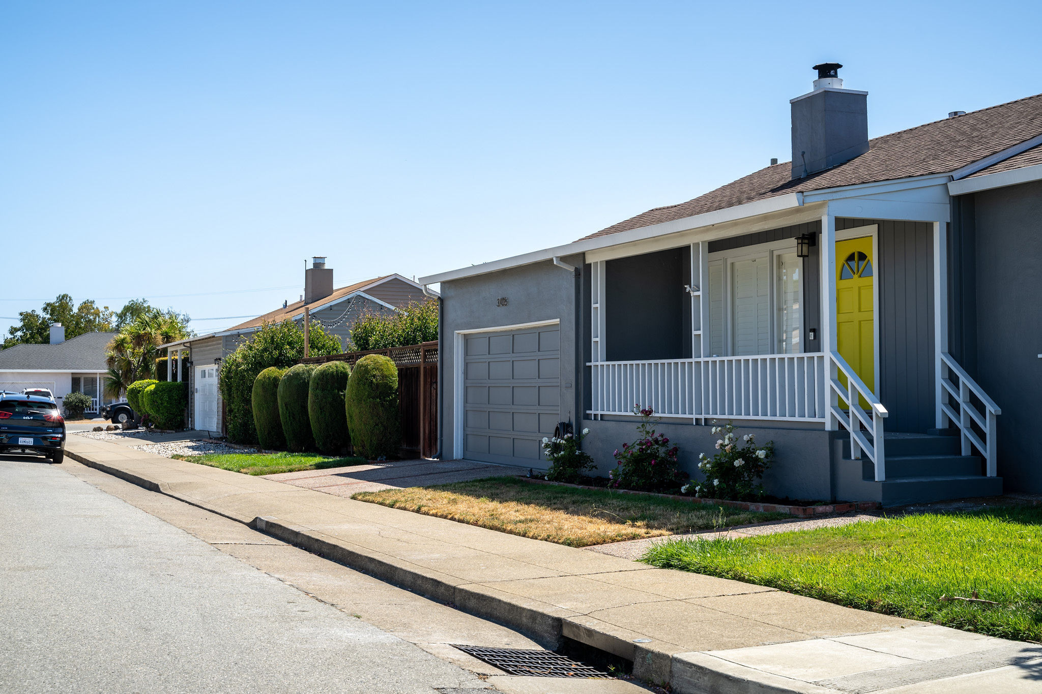 Ranch style home with yellow door in The Village area in San Mateo