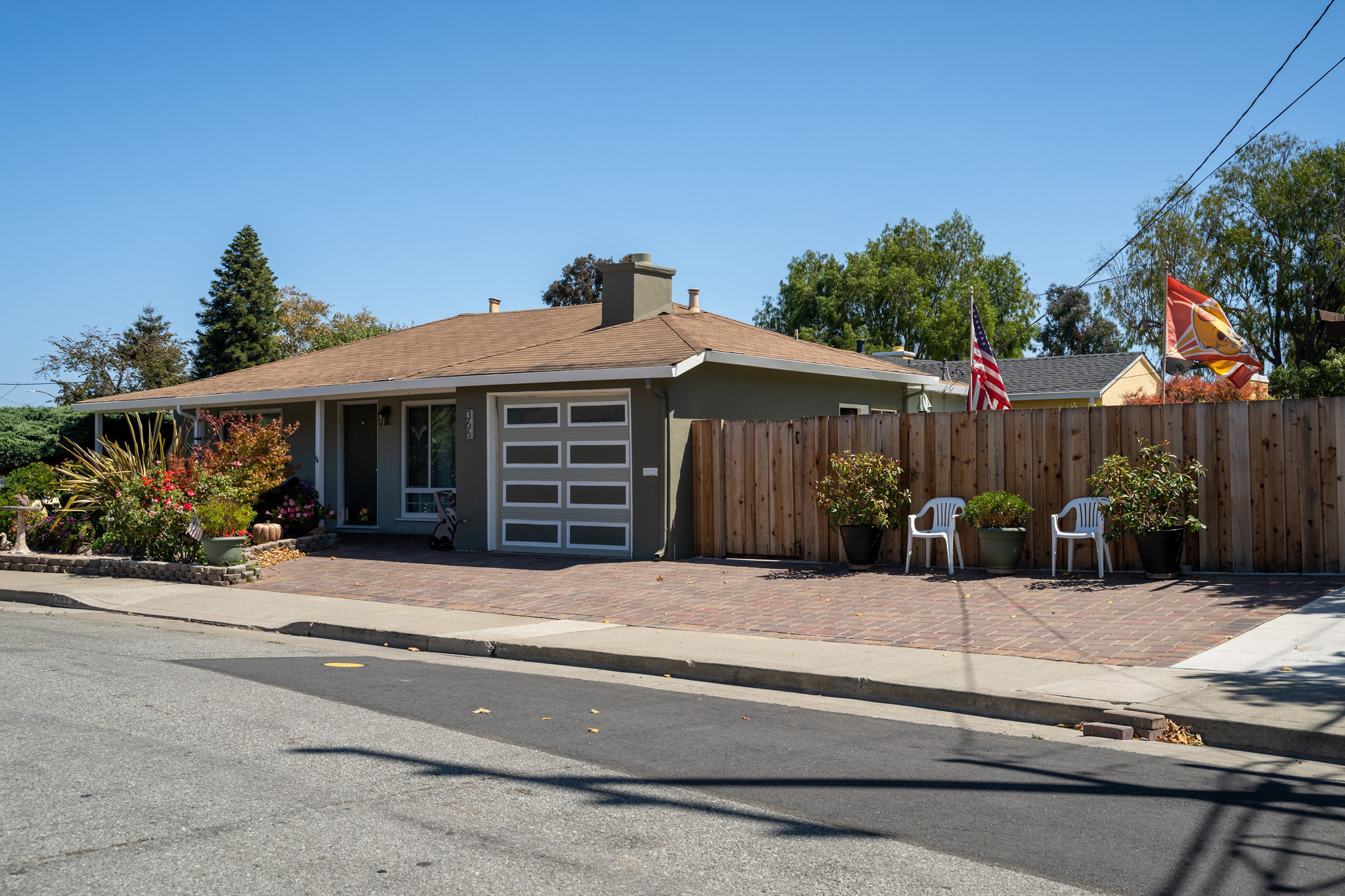 Ranch style home with american flag in The Village area in San Mateo