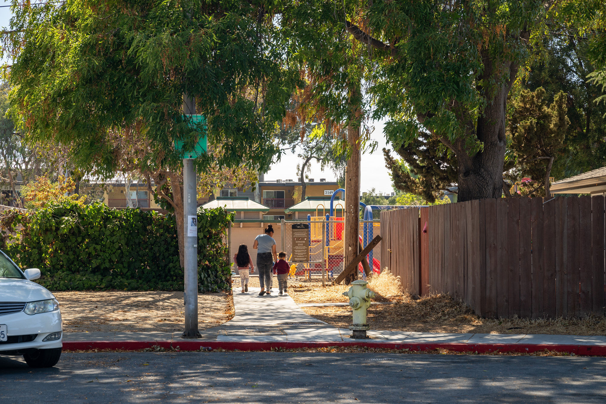 Family walking to park n the Los Prados area in San Mateo