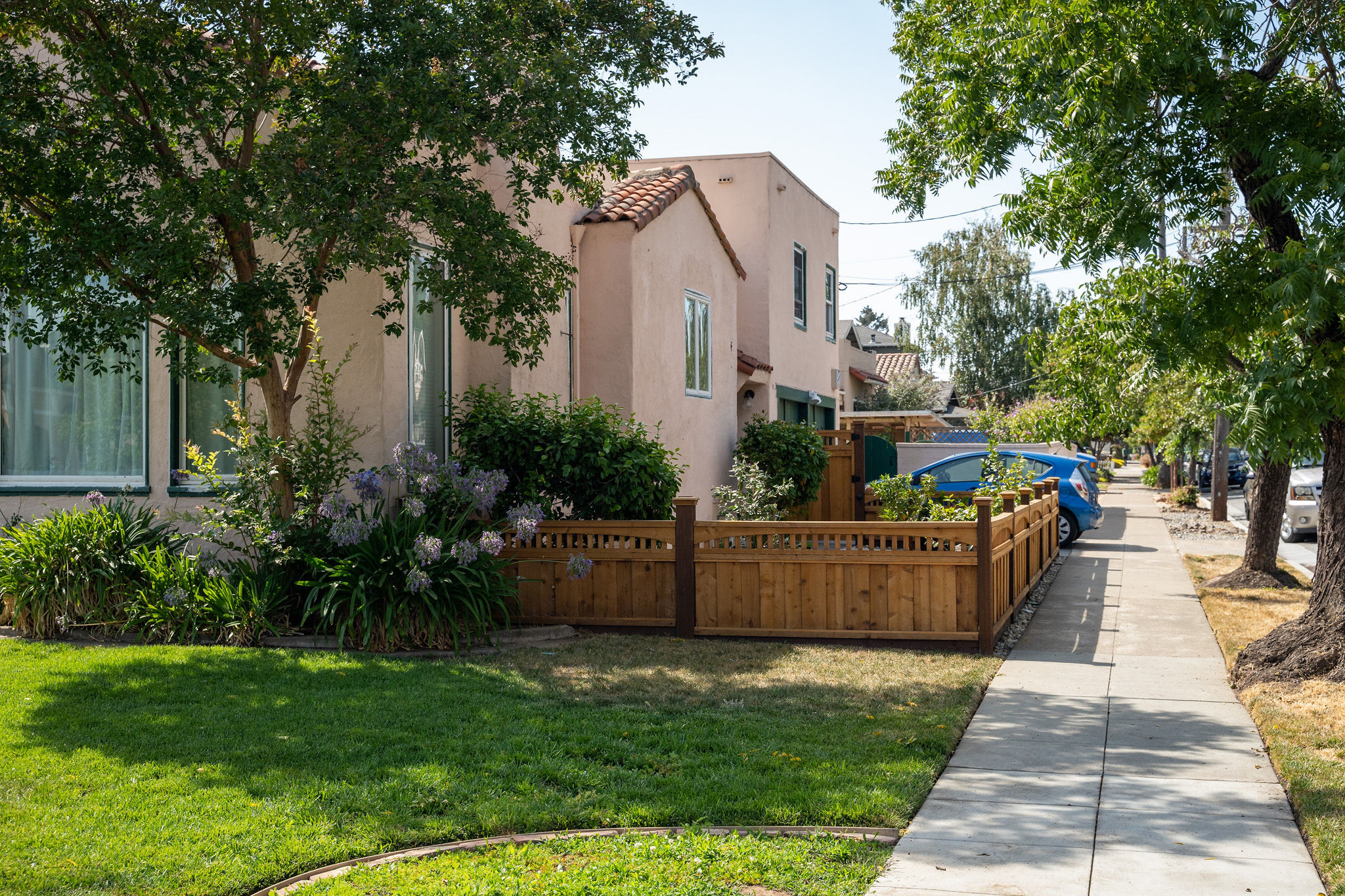 Spanish style home with wood fence in the Parkside area in San Mateo