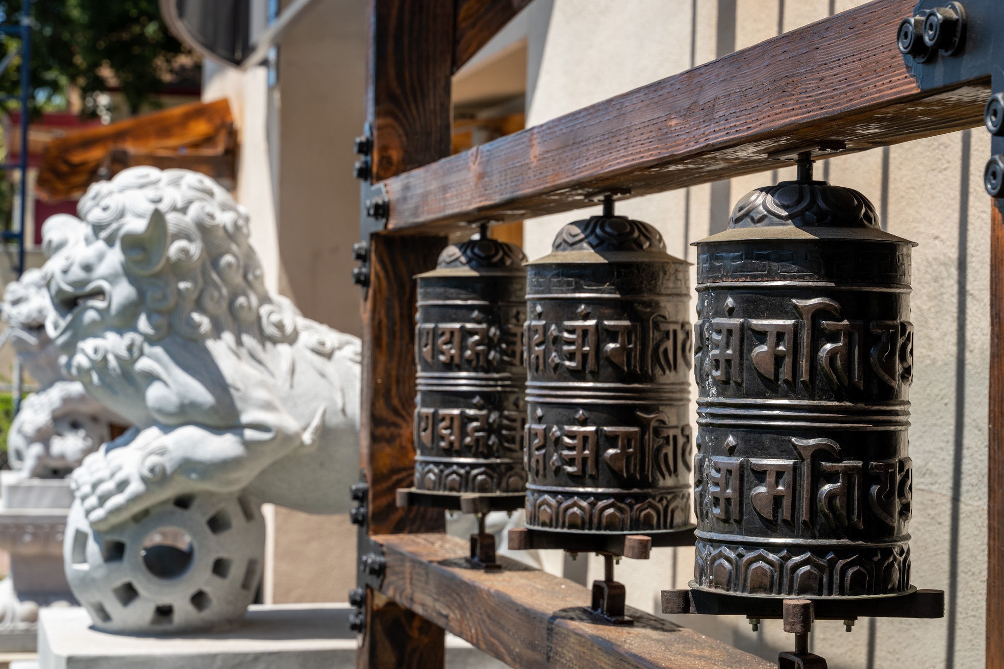 Bowie Estate prayer wheels and two guardian lion dog statue in San Mateo.
