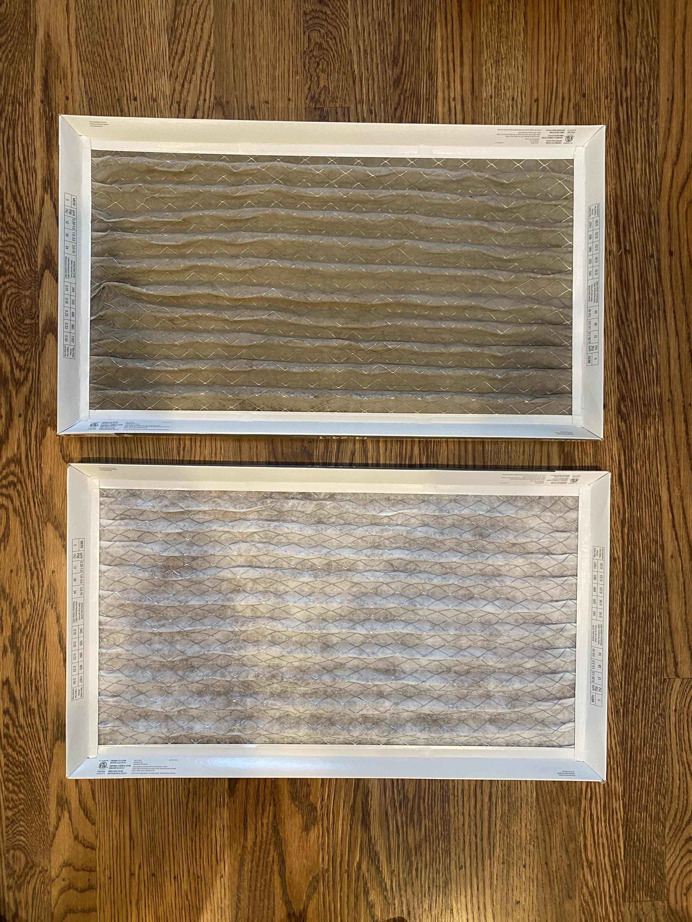 Our old MERV 5 cold air return filter on top vs a new MERV 13 below.