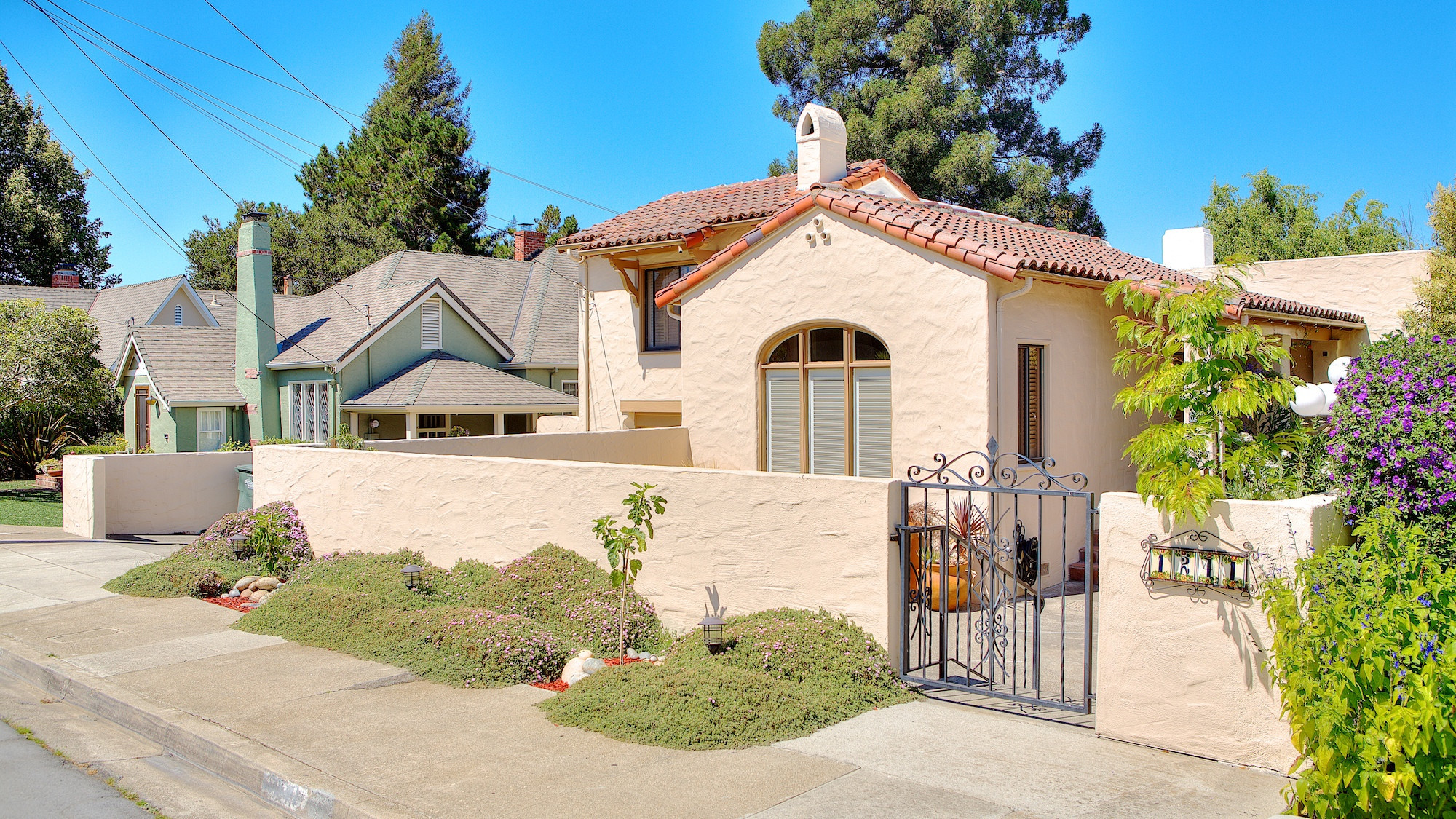 Spanish style home with concrete fence in San Mateo.