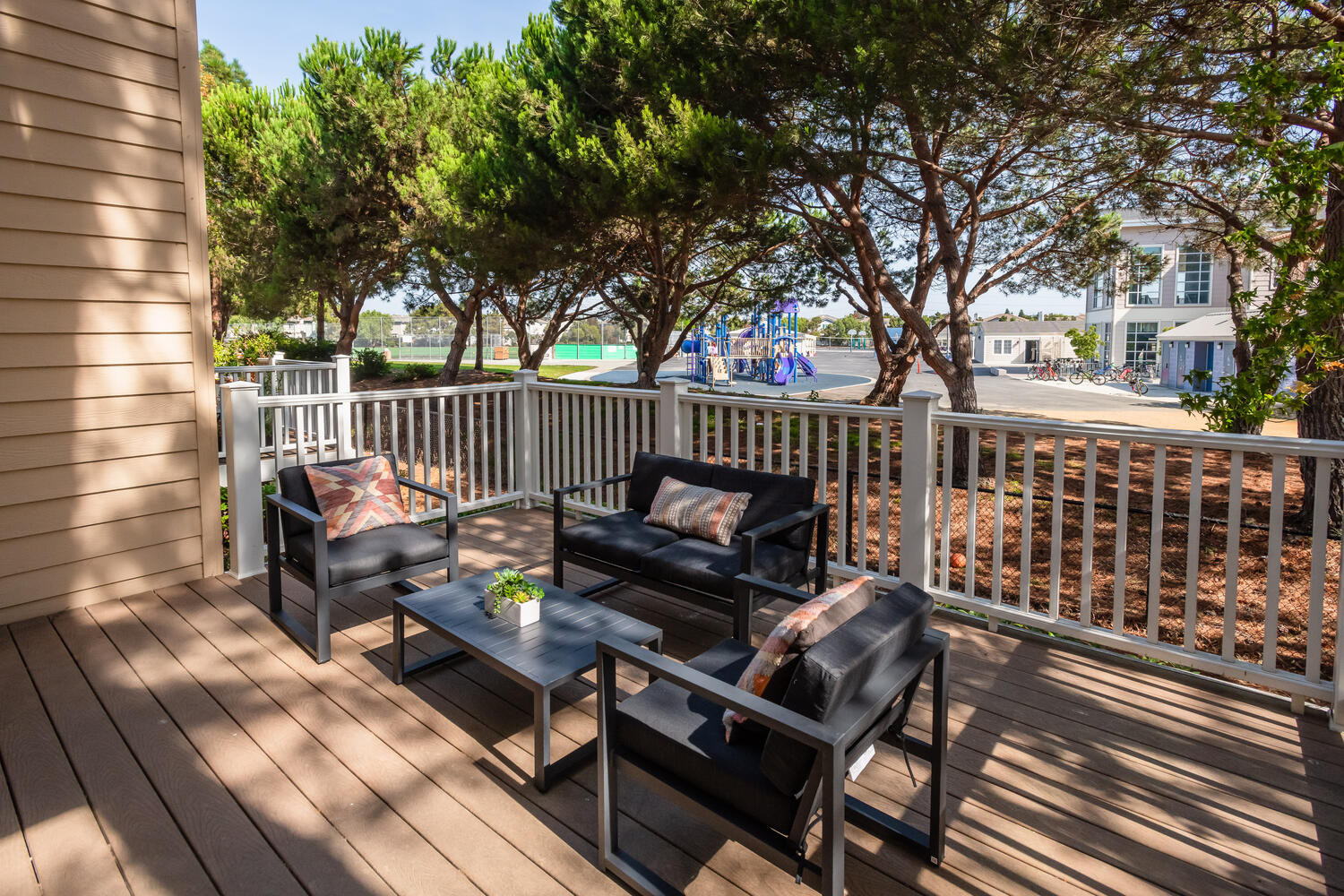 Patio table and chairs in Lighthouse Cove area in Redwood Shores.