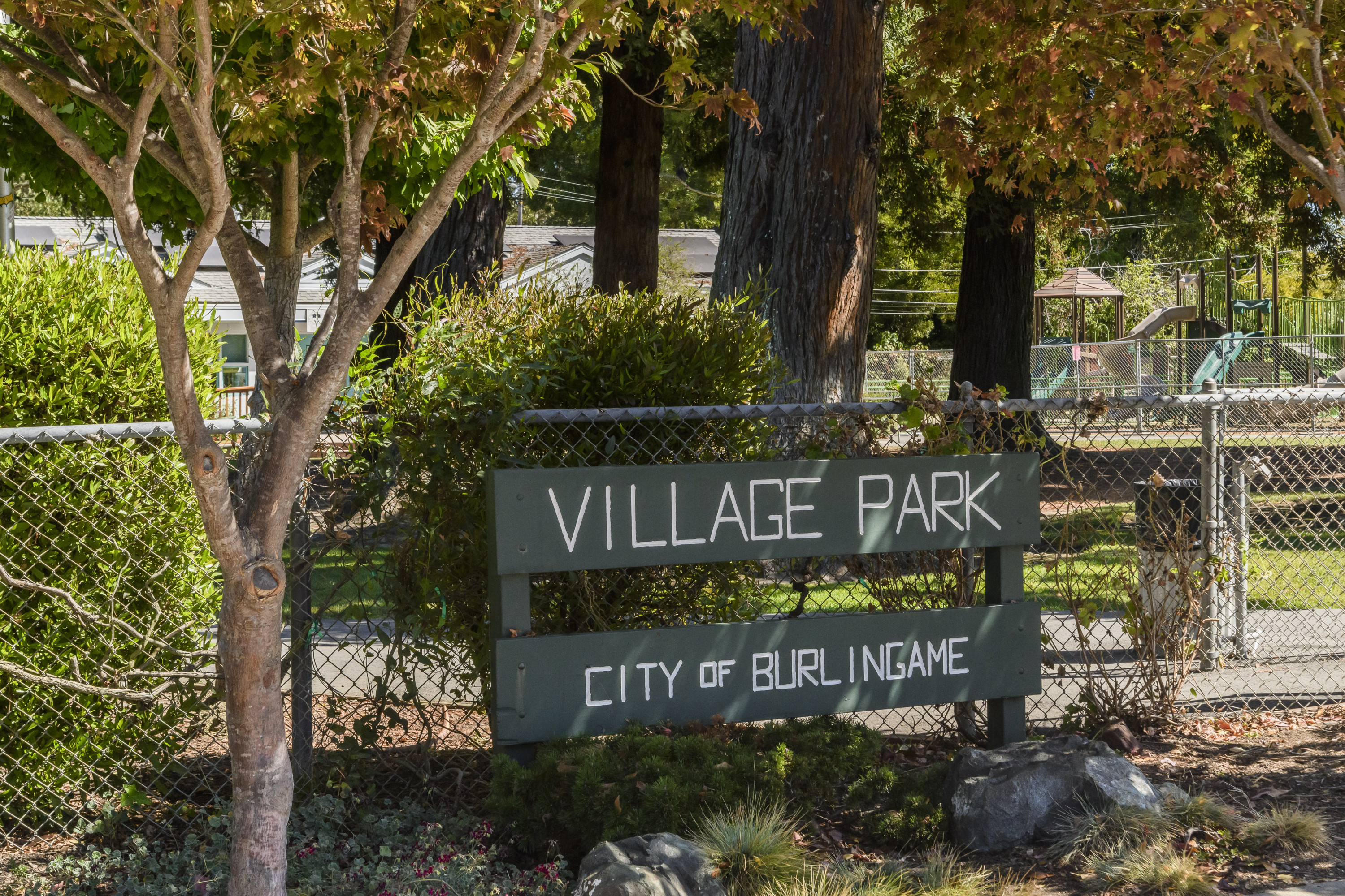 Burlingame Village wood panels with the Village Park sign in Burlingame.